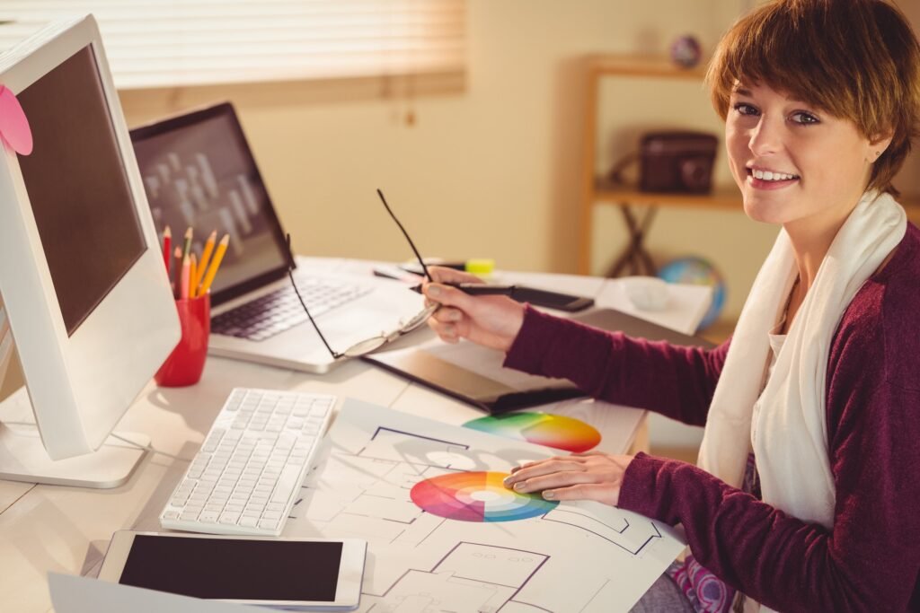 Graphic designer working at desk in office